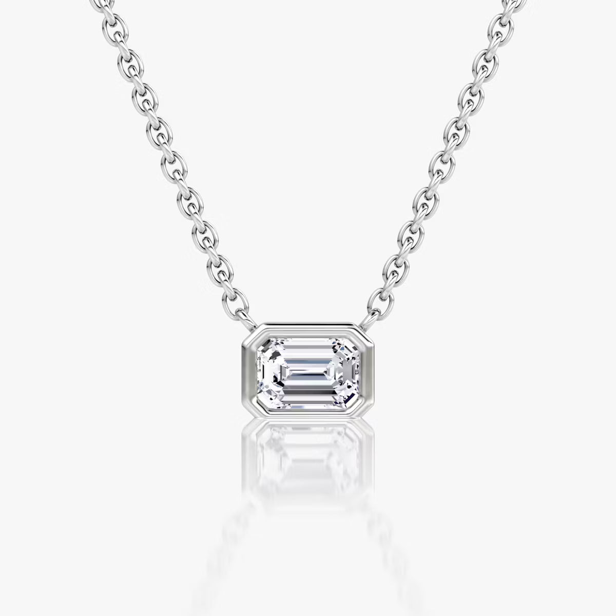 שרשרת סוליטר יהלום אמרלד מרחף בשיבוץ בזל מזרח-מערב