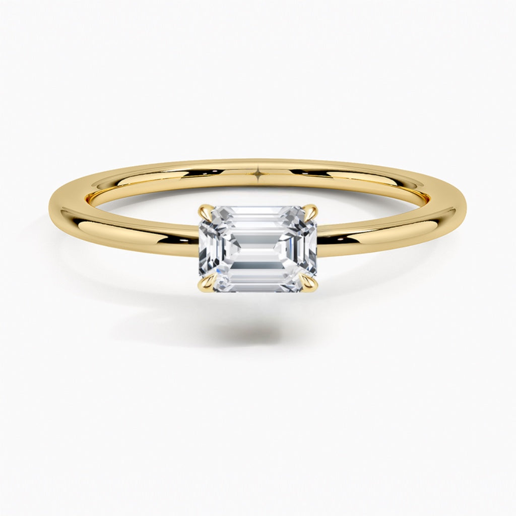 טבעת סוליטר בשיבוץ מזרח מערב יהלום אמרלד 1 קראט