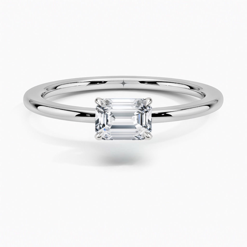 טבעת סוליטר בשיבוץ מזרח מערב יהלום אמרלד 1 קראט