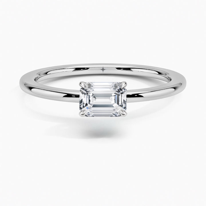 טבעת סוליטר בשיבוץ מזרח מערב יהלום אמרלד 1 קראט